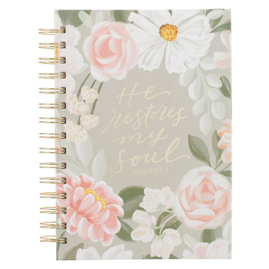 Journal with floral design and text on a white background