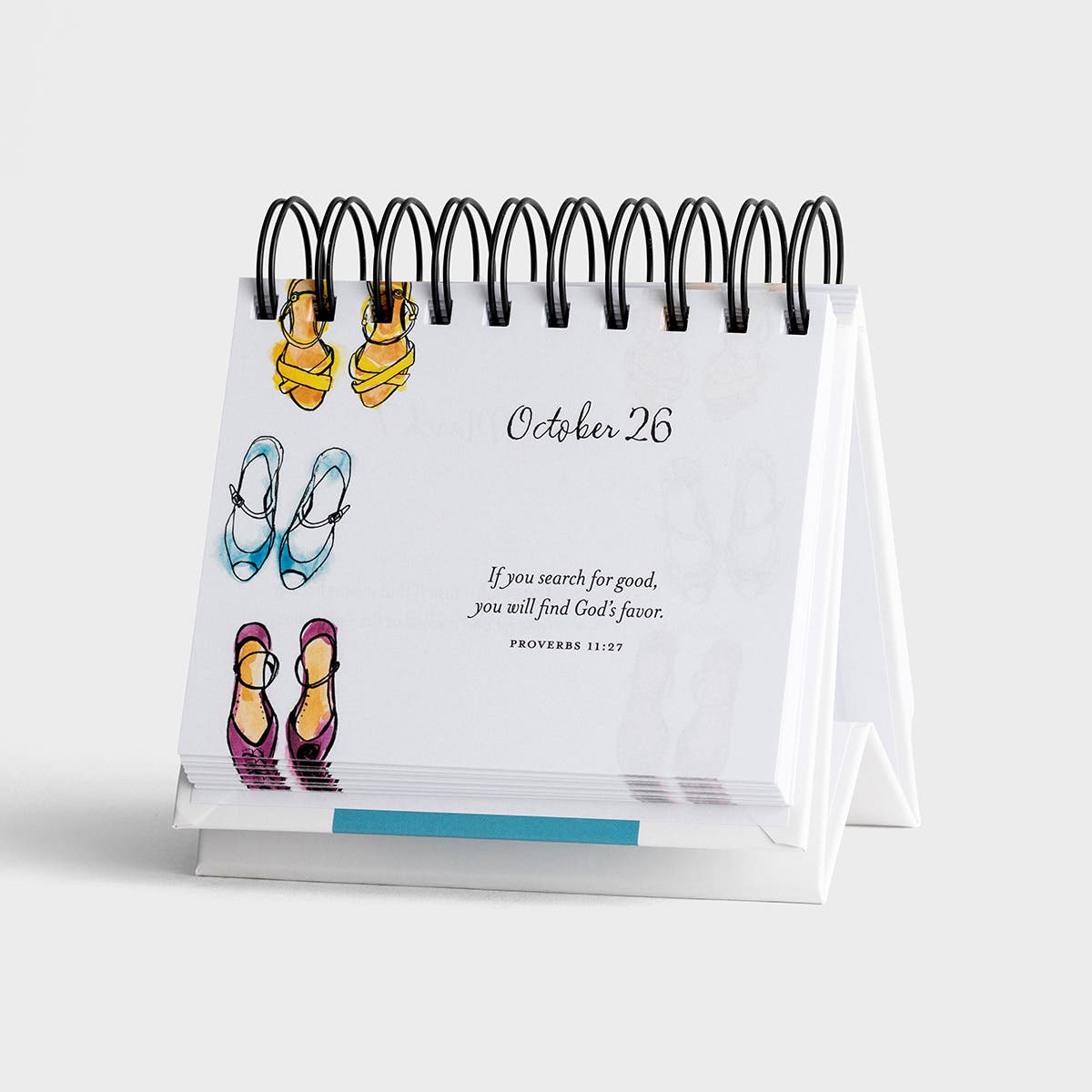 Small desk calendar with illustrations of shoes on a white background