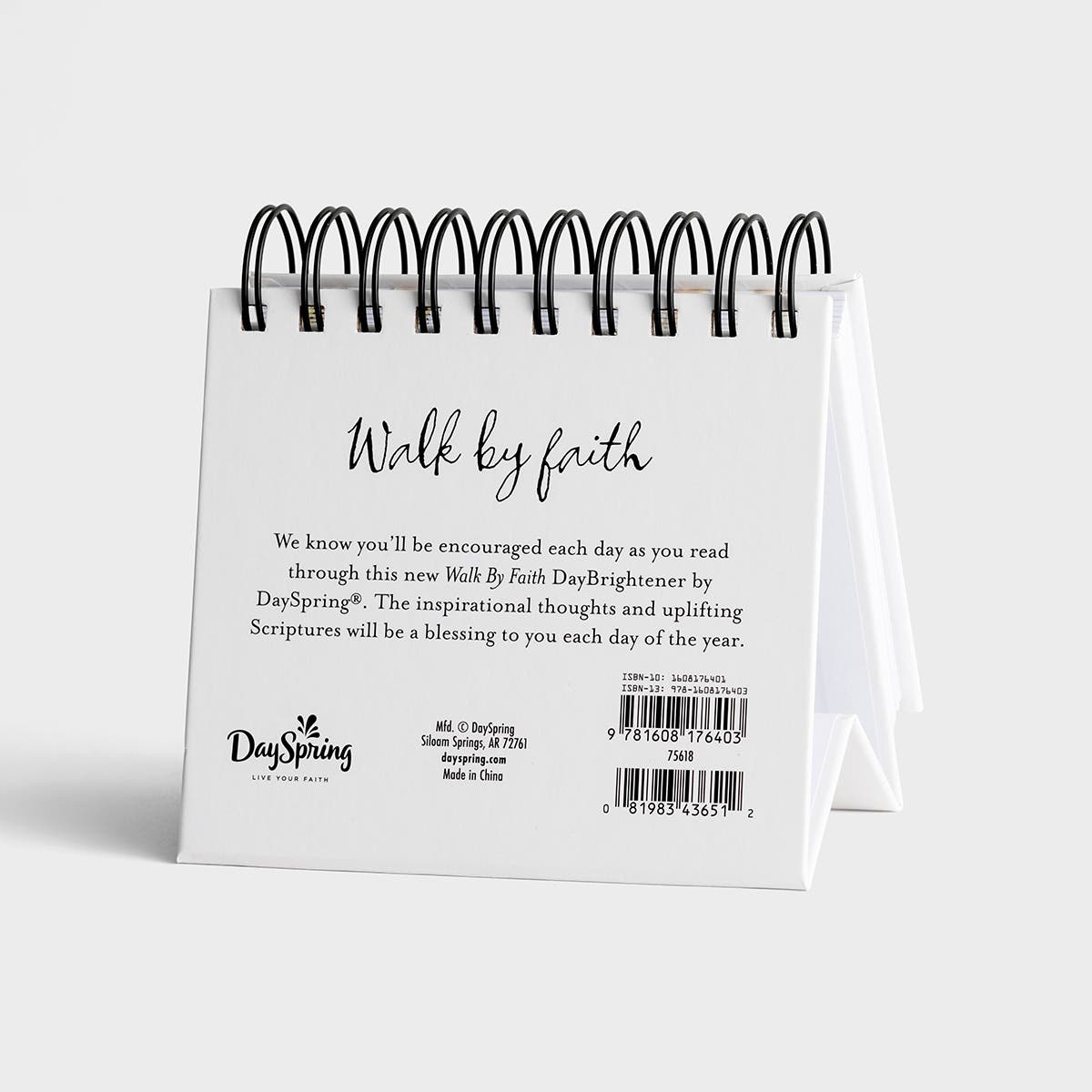 Desk calendar with 'Walk by faith' text on a white background