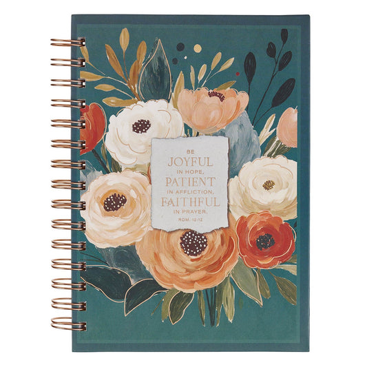 A spiral-bound journal with a teal cover decorated with watercolor-style flowers in peach, cream, and red, plus a central quote card reading 'Be JOYFUL in HOPE, PATIENT in APPLICATION, FAITHFUL in TRIAL. ROM.