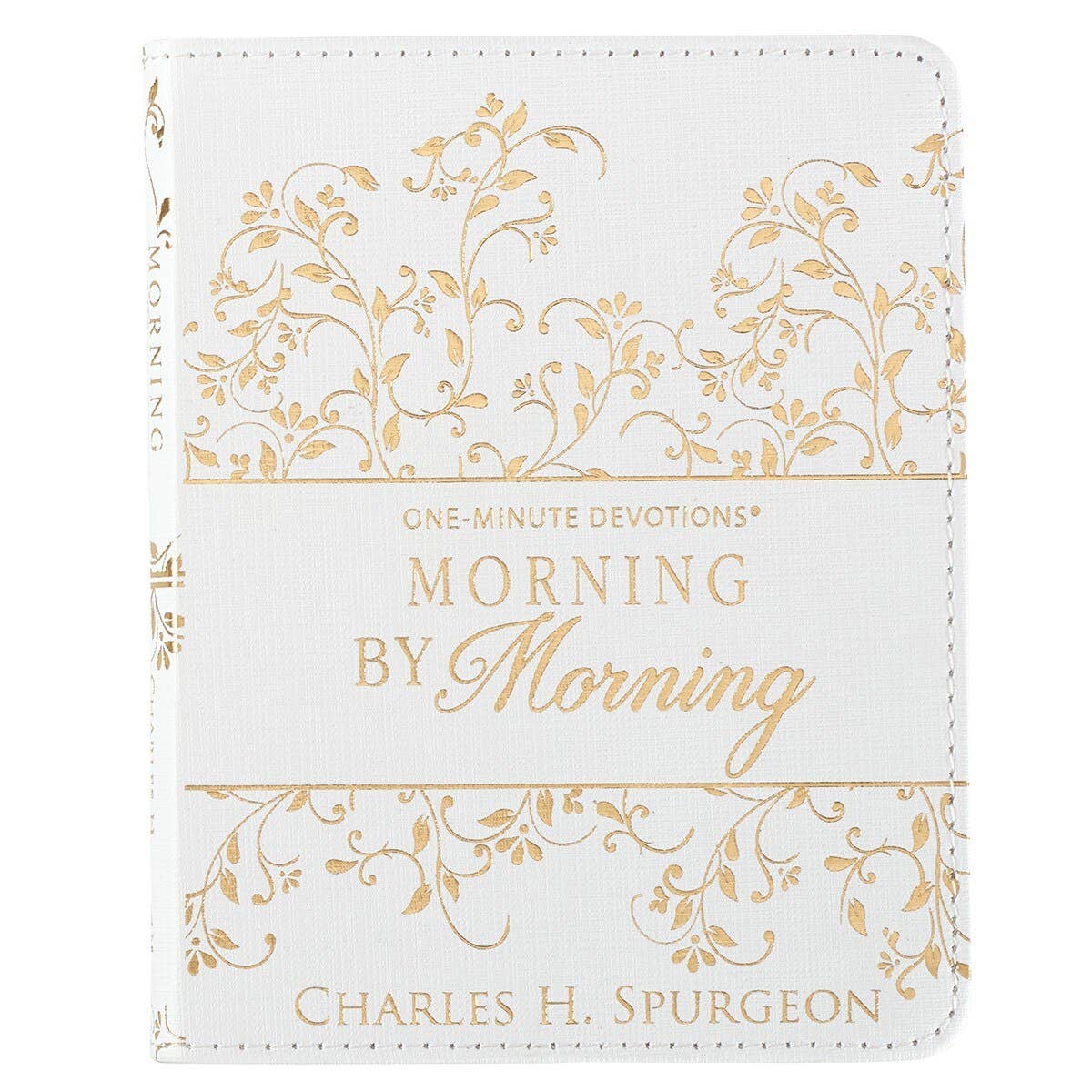 White book with gold floral patterns and text on a white background